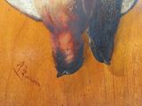 un tableau représentant un oiseau posé sur une table
