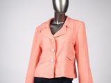 an image of a mannequin mannequin wearing a pink jacket and black skirt