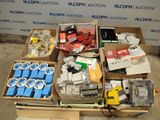 boxes of assorted electrical equipment are sitting on the floor