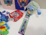 a lot of items on the table including a toothbrush, toothpaste, toothbrushes, and other items