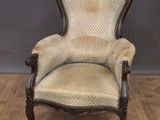 an old fashioned chair on a wooden floor in a room