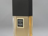 a bottle of chanel perfume sitting on top of a table
