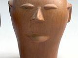 two vases that have been made to look like heads