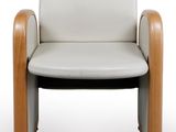 an image of a white leather chair with wooden legs