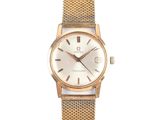 a close up of a watch on a white background