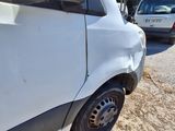 a white van that is parked on the side of the road