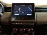 the dashboard of a car with a gps device in the center
