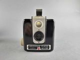 a black and white photo of a brownie flash camera
