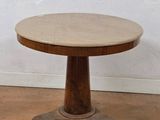 an image of a wooden table with a marble top on a hard wood floor