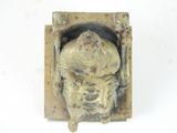 a statue of a man sitting in a box
