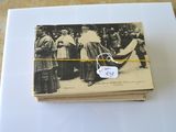 an old photo of a couple of people standing next to each other on a table