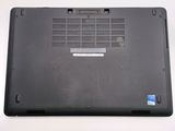 a black laptop with a small hole in the back