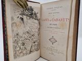 un livre ouvert sur lequel repose une main dorée