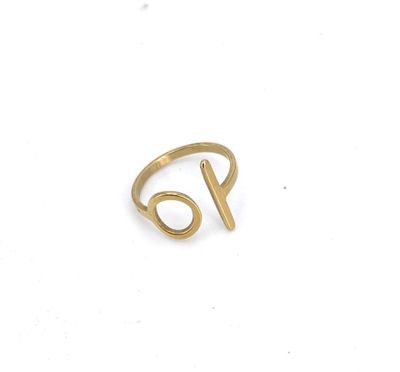 a close up of a gold ring on a white surface