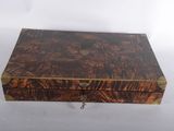an old wooden box with a key hanging from it ' s side