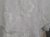 a close up of a white table cloth on a mannequin head
