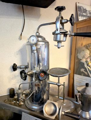 a coffee maker sitting on a table in a room
