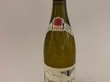 a bottle of wine that is sitting on a table