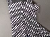 a chanel tie with a chanel logo on it