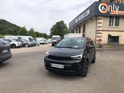 a black car parked in front of a building