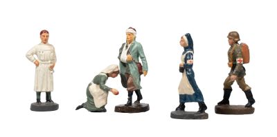 five figurines of people standing in a line