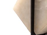 a piece of soap sitting on top of a black shelf