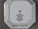 a white plate with a picture of a man on it