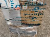 many boxes of water sitting on the ground