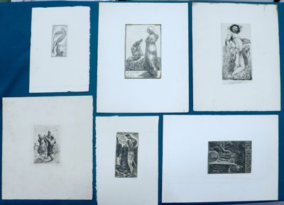 several drawings of people are displayed on a blue cloth