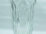 a glass vase that is sitting on a table