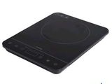 a close up of a black induction cooktop on a white background