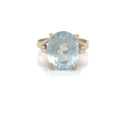 an image of a ring with a blue topaz stone
