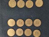 a close up of a book with a bunch of coins on it