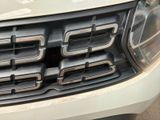 a close up of the front grille of a truck