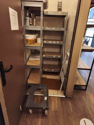 a metal shelf that has some shelves on it