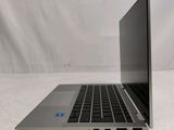 an open laptop computer sitting on top of a white table