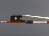 the bow is made of wood and has a white string