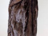 brown fur jacket on a mannequin stand