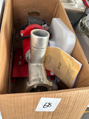a cardboard box with a metal object inside of it