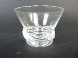 a clear glass cup with a design on it