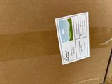 a cardboard box with a sticker on it sitting on a table