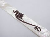 an image of a white tie with a lizard on it