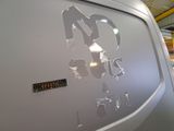 a sticker on the side of a van that has been vandalized