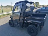 an image of a utility vehicle parked on the side of the road