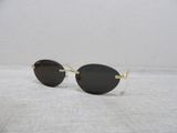 a close up of a pair of sunglasses on a white surface