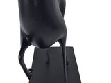 statue of a black bird on a black base on a white background