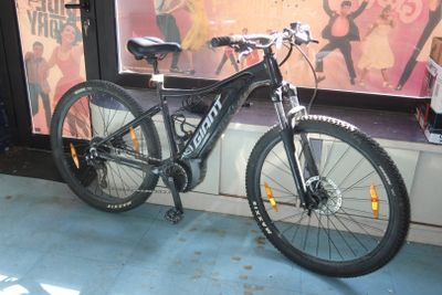 a bicycle that is parked in front of a window