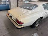 a white car that is parked in a garage