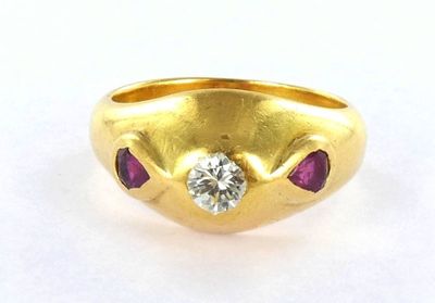 an image of a gold ring with a diamond and ruby stones