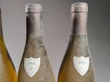 three bottles of wine sitting next to each other on a table